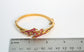 21k Yellow Gold Ruby Floral Bangle, 6.75 inches - 22.5g