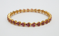 21k Yellow Gold Ruby Bangle, 7 inches - 22.8g