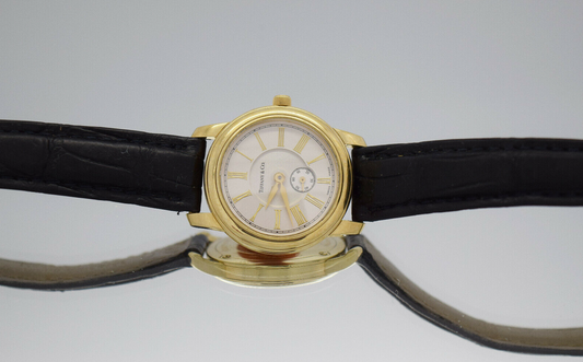 Tiffany & Co 18k Yellow Gold Round Roman Dial Quartz Watch 27mm